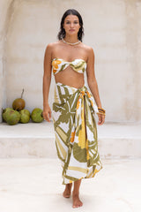 Large scale retro palm print sarong tied up around the waist olive green colourway worn with our signiture wrap tied up 70s style as a boob tube  100% rayon  chunky bangles to compliment