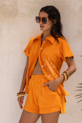 Vintage inspired terry towelling, elasticated shorts with side splits and 70s patch pockets.
