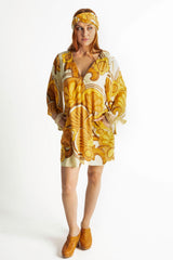 60s inspired mini smock dress with bell sleeves, patch pockets and a v-neckline. Features a bold, large-scale mustard and brown retro geo print. Made in 100% cotton