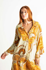 70s style button up shirt  in a bold large scale retro floral print in rich mustard and cream tones. Made in 100% rayon