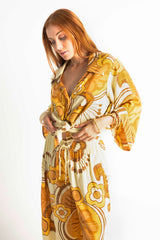 70s style button up shirt  in a bold large scale retro floral print in rich mustard and cream tones. Made in 100% rayon