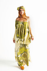 Bohemian style one shoulder maxi dress featuring a long, flowy frill that covers one arm and drapes elegantly down to the hips. This dress has side splits and showcases a large-scale bold, retro inspired print in rich green and cream tones. Made in 100% rayon.