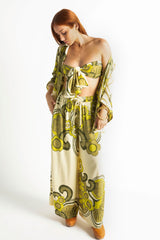 Elasticated wide leg pants in a bold large scale retro floral print in rich green and cream tones. Made in 100% rayon