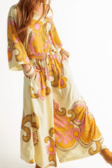 Elasticated wide leg pants in a bold large scale retro floral print in tangerine, pink, orange and cream tones. Made in 100% rayon
