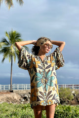 Vintage inspired bohemian style button up smock dress in a large scale floral print in blues and mustard with a cream  background