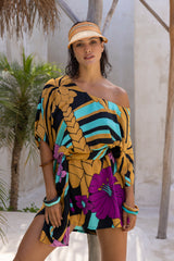 Large scale retro palm print flowy summer resortwear kaftan dress with round neckline batwing style 3/4 sleeves and drapes longer at the back 100% rayon black magenta and aqua colourway with colourful bangles to compliment