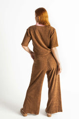 Back view of our 70s style retro terry towelling luxe leisure set. Mocha brown with pink spliced retro stand-up collar and pocket details. Cotton medium weight terry fabric with 2% elastane