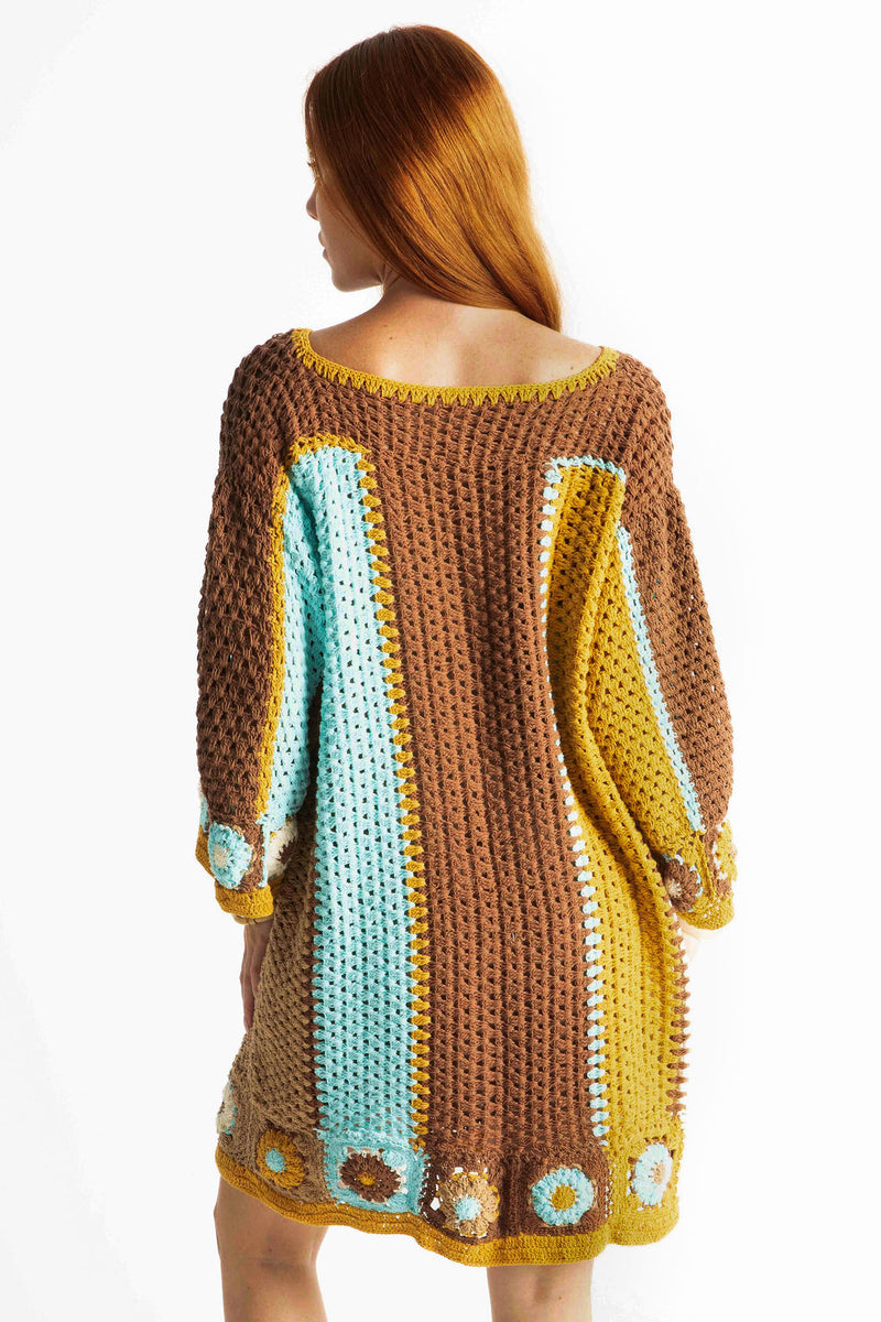 Back view of our Boho style hand crochet smock dress with 3/4 wide sleeves in aqua chocolate mustard and cream large stripes. This 60s style bohemian dress has  flower detail on the arms and bottom and made in 100% cotton