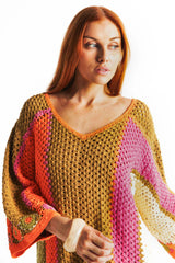 Boho style hand crocheted smock dress with 3/4 wide sleeves, featuring bold, pistachio, pink, orange and cream stripe sections and floral crochet details on the arms and hem. Made in 100% cotton