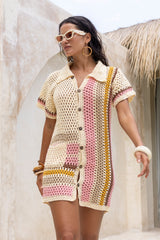 Hand crochet retro style button up shirt dress. Cream colour base with 70s vintage stripes in pink, mustard, mulberry and beige. Vertical stripes on one side and horizonatal stripes on the other side. 70s style collar and coconut buttons brings retro chic vibes