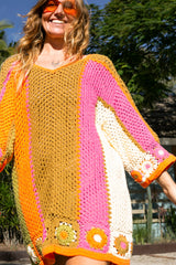 Boho style hand crocheted smock dress with 3/4 wide sleeves, featuring bold, pistachio, pink, orange and cream stripe sections and floral crochet details on the arms and hem. Made in 100% cotton