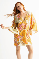 60s inspired mini smock dress with bell sleeves and a v-neckline. Features a bold, large-scale tangerine, pink and brown retro geo print. Made in 100% cotton