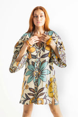 Vintage inspired bohemian style button up smock dress in a large scale floral print in blues and mustard with a cream  background
