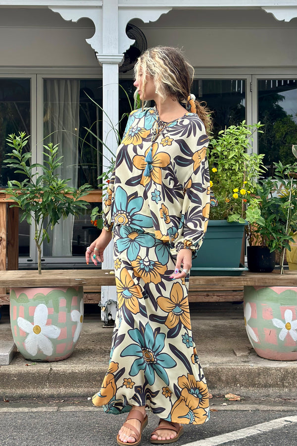 Vintage inspired A-line high waist maxi skirt in a large scale floral print in blues and mustard with a cream  background