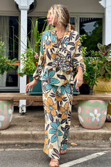 Vintage inspired A-line high waist maxi skirt in a large scale floral print in blues and mustard with a cream  background