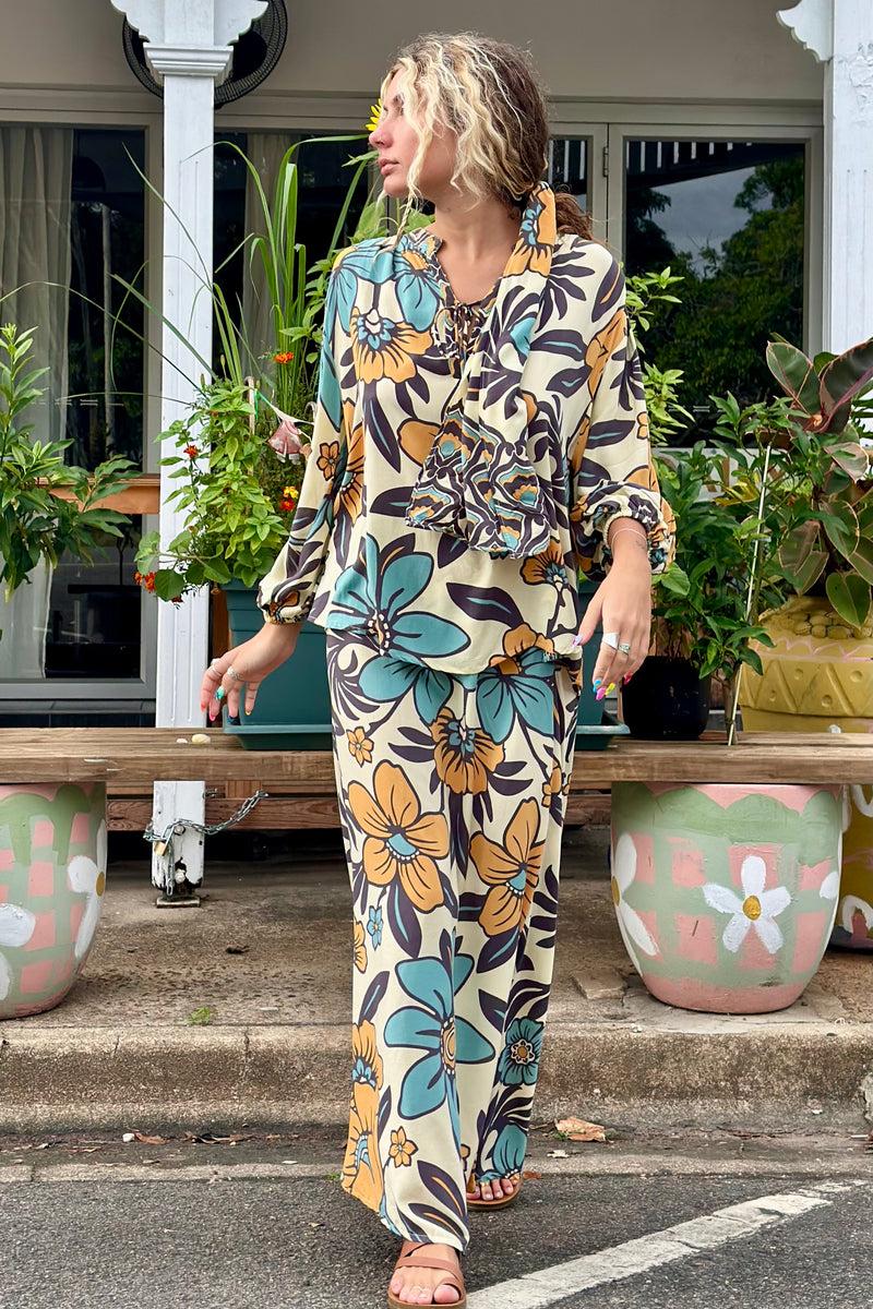 Vintage inspired A-line high waist maxi skirt in a large scale floral print in blues and mustard with a cream  background