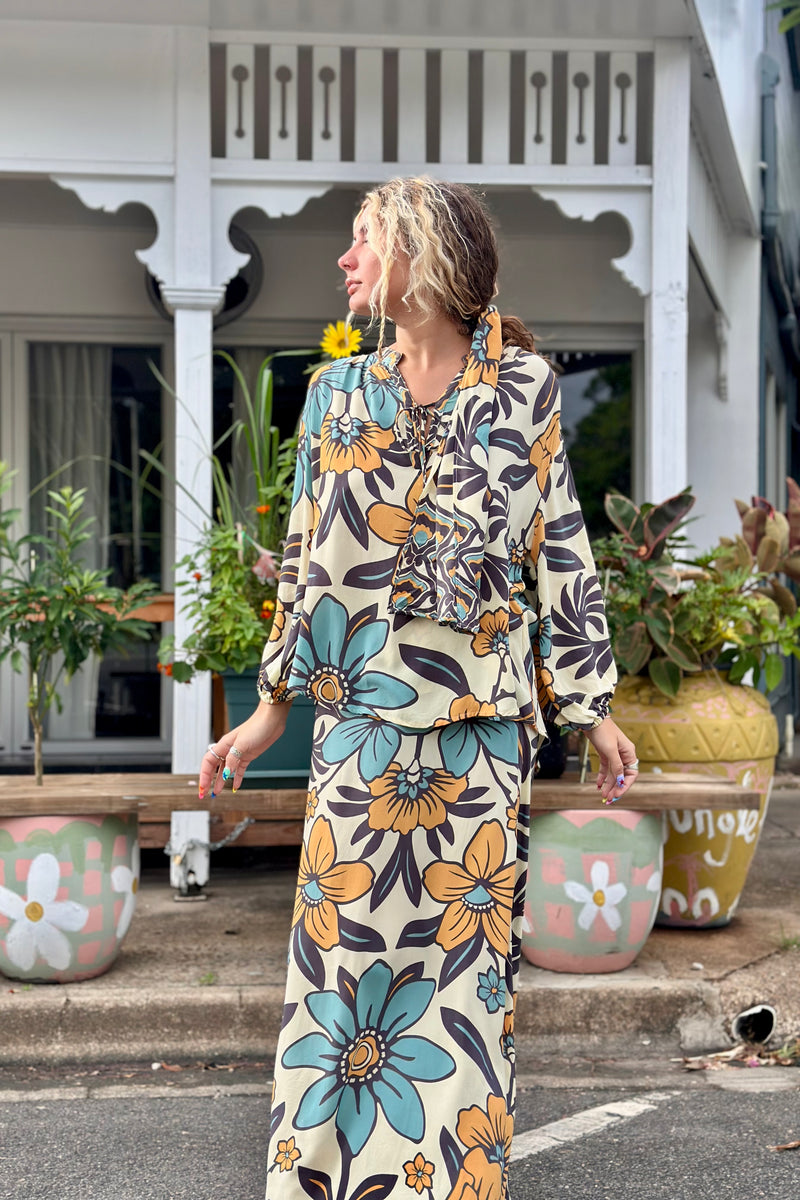 Vintage inspired A-line high waist maxi skirt in a large scale floral print in blues and mustard with a cream  background