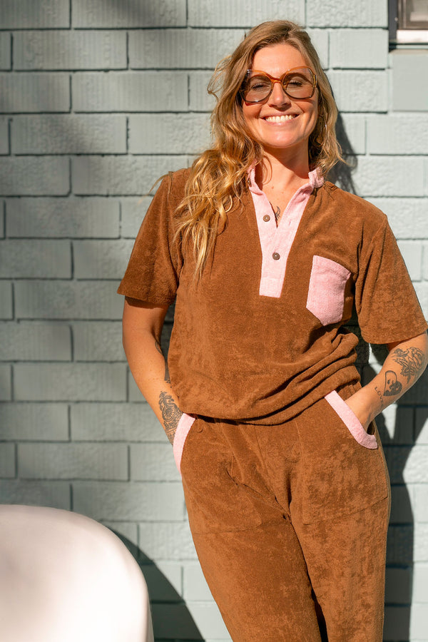 70s style retro terry towelling luxe tracksuit. Mocha brown with pink spliced retro stand-up collar and pocket details. Cotton medium weight terry fabric with 2% elastane