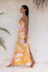 Large scale retro palm print flowy summer maxi bias slip dress with side splits  100% flamingo pink  colourway with chunky bangles to compliment