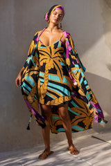 Large scale retro palm print summer mini bias slip dress with matching Zsa Zsa robe unbuttoned and head wrap  100% black magenta and aqua colourway with chunky bangles to compliment