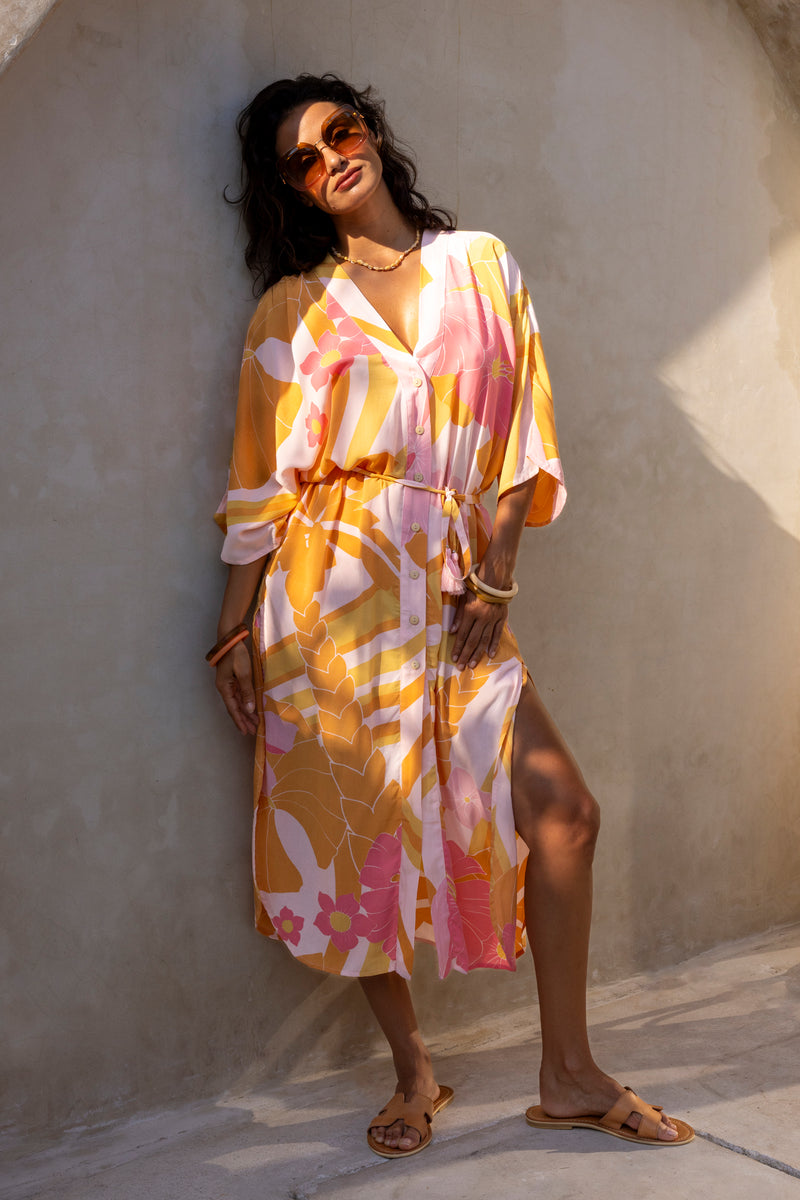 Large scale retro palm print button up robe  with side splits and tie 70s style batwing sleeves this midi length dress can also be worn as a boho glam kaftan flamingo pink colourway 100% rayon