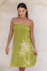 This vintage inspired strapless terry towelling dress, with its elasticated top, slips on effortlessly. Olive green and finished with our signature screen-printed palm design and a chic side split, it’s a timeless piece with a touch of sophistication. Made in a cotton / elastane blend.
